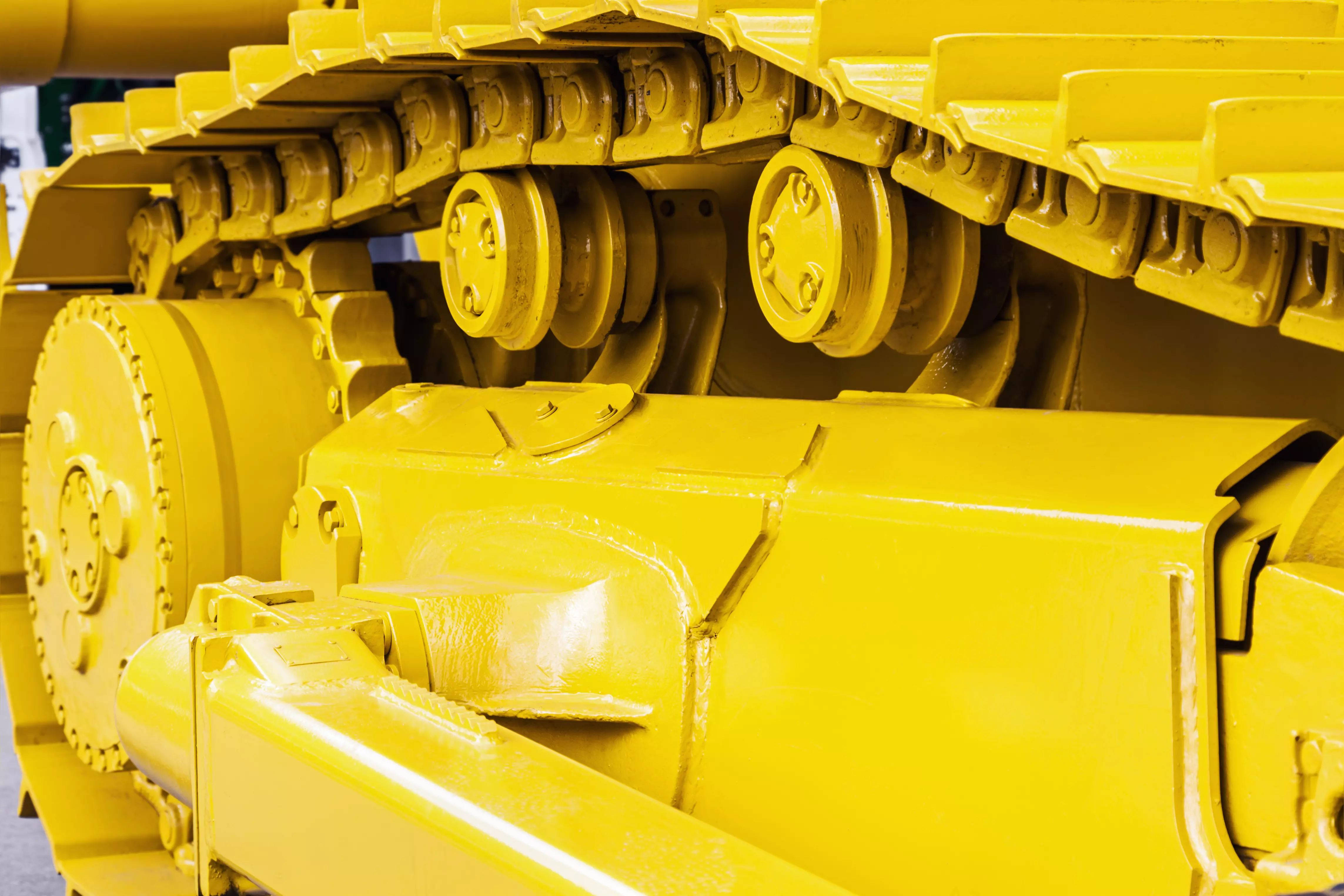 Tendeur pour machines avec chenilles en caoutchouc